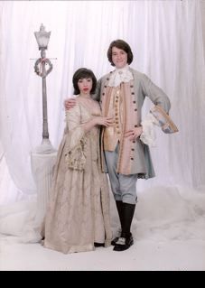 two people in Louis !V dress