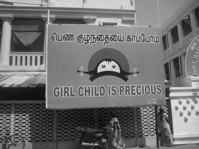 among other beings... a banner in India saying "Girls are Precious"