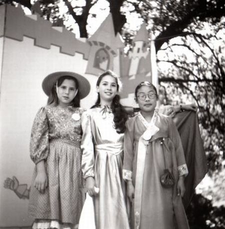 three little girls in costumes