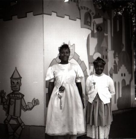 two happy little girls dressed up