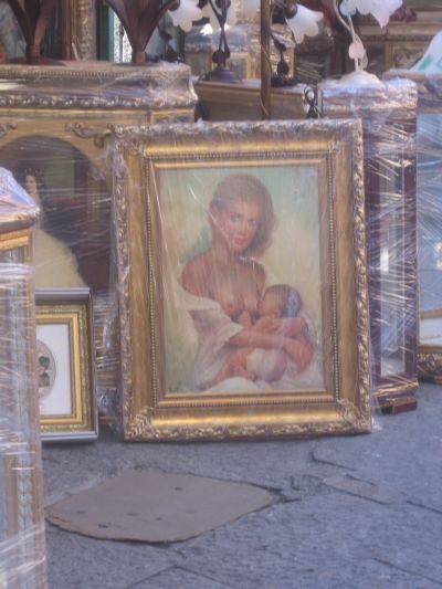 so many meanings in here I can't even start naming them... a kitsch portrait of a mother breastfeeding her child