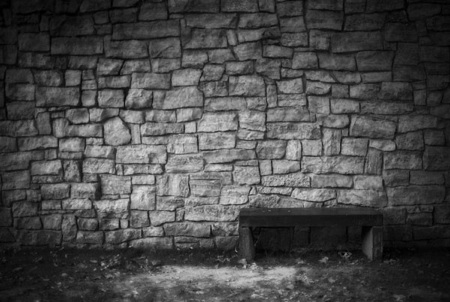 ...and you knew it went the right way or the wrong way... a bench against a stone wall