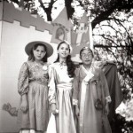 three little girls in costumes