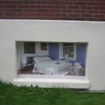 a bedroom painted into a niche on a wall