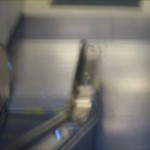 an out of focus escalator to an underground station