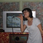woman singing in a Korean Karaoke bar