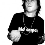 kid carpet listens to a ball of yarn