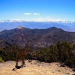 a ghost waving his hat in front of the Sierras