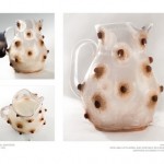 a milk jug covered with nipples